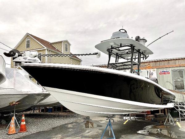 Slide: The Image of 2023 Crevalle 26 HBW boat on display in a marina. - 7