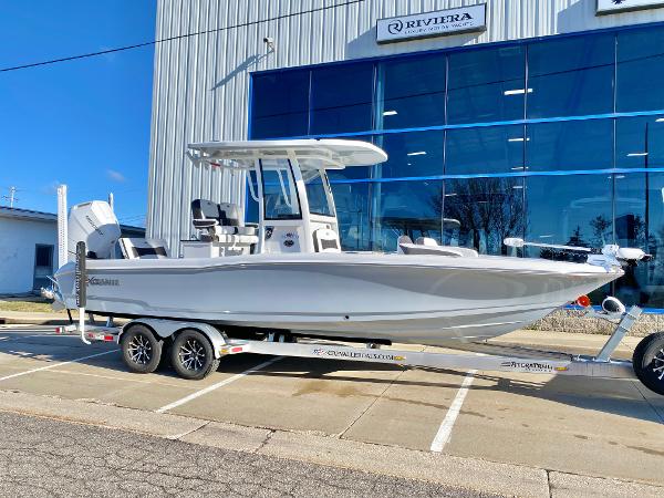 Slide: The Image of 2024 Crevalle 26 HCO boat on a trailer outside a dealership. - 0
