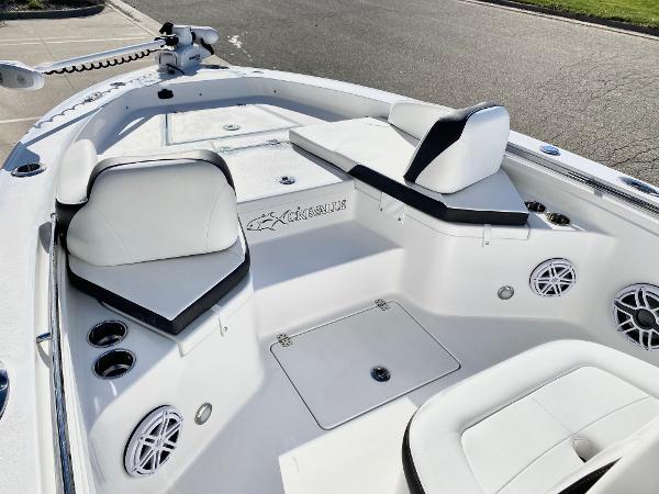 Slide: The Image of 2024 Crevalle 26 HCO boat interior with white seating and cup holders. - 10