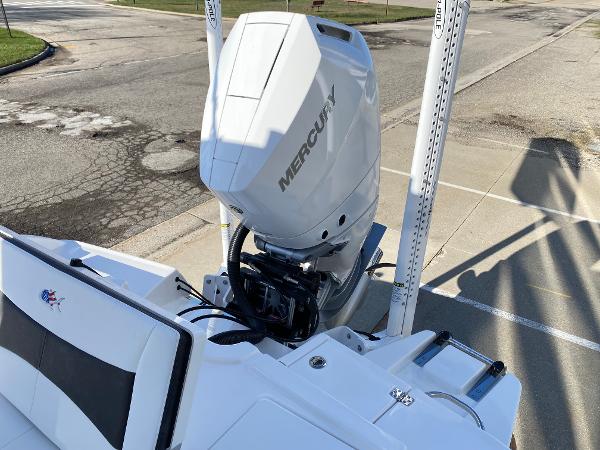 Slide: The Image of 2024 Crevalle 26 HCO boat with Mercury outboard engine, rear view. - 3