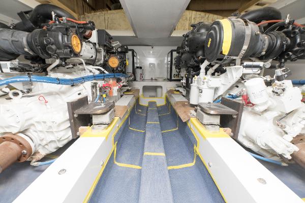 Slide: The Image of Engine room of a 2024 Custom Carolina 63 yacht with dual engines. - 22