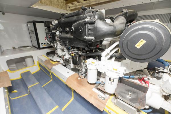 Slide: The Image of Engine room of a 2024 Custom Carolina 63 yacht with CAT machinery. - 24