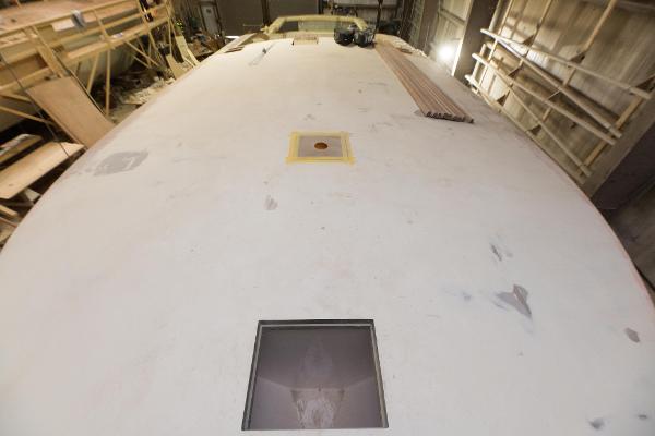 Slide: The Image of Custom Carolina 63 boat under construction, 2024 model, in a workshop. - 37