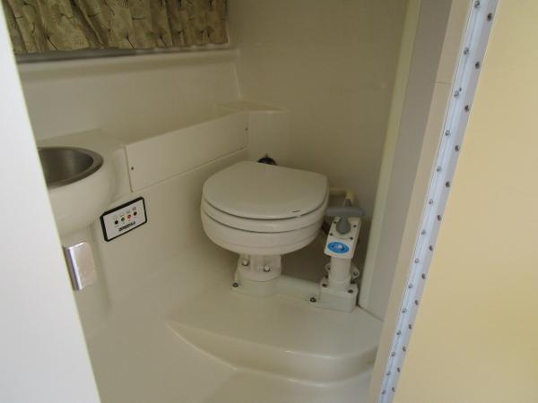 Slide: The Image of 2000 Formula 280 SS boat bathroom with toilet and sink. - 12