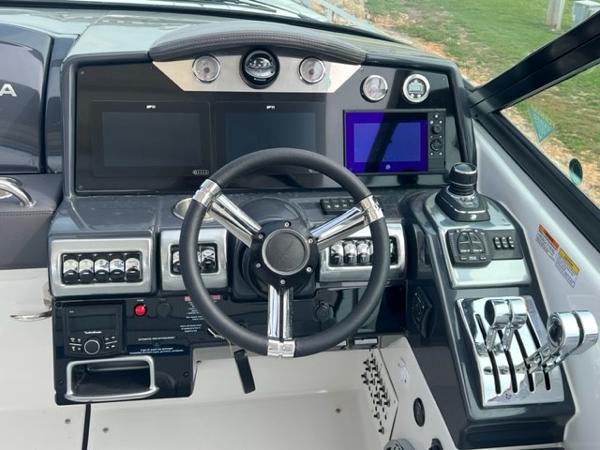 Slide: The Image of 2023 Formula 350 CBR boat dashboard with advanced controls and navigation screens. - 4