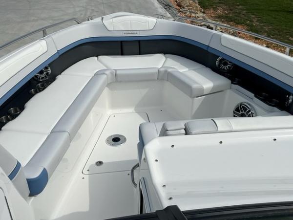 Slide: The Image of 2023 Formula 350 CBR boat interior with white seating and modern design. - 6