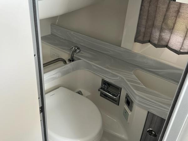 Slide: The Image of 2023 Formula 350 CBR boat bathroom with modern fixtures and sleek design. - 9