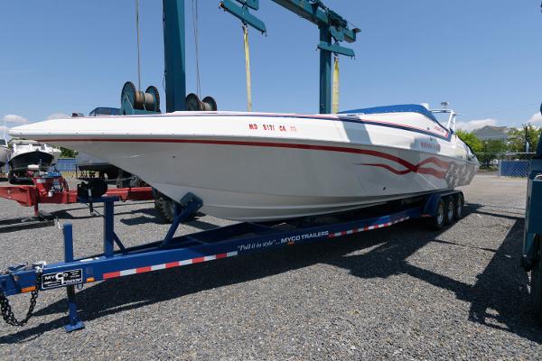 Slide: The Image of 1991 Fountain 38 Sport Cruiser on trailer in boatyard. - 1