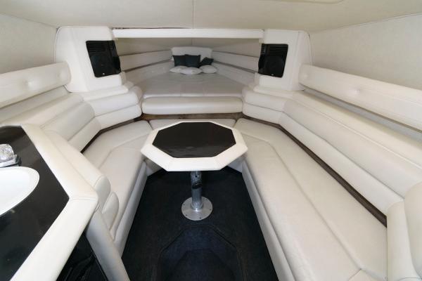 Slide: The Image of Interior of 1991 Fountain 38 Sport Cruiser with white seating and table. - 11