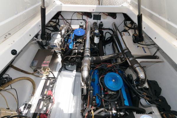 Slide: The Image of 1991 Fountain 38 Sport Cruiser engine compartment with dual engines and batteries. - 17