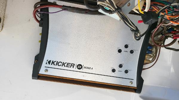 Slide: The Image of Kicker ZX M350.4 amplifier in a 1996 Four Winns 190 Horizon Bowrider boat. - 14