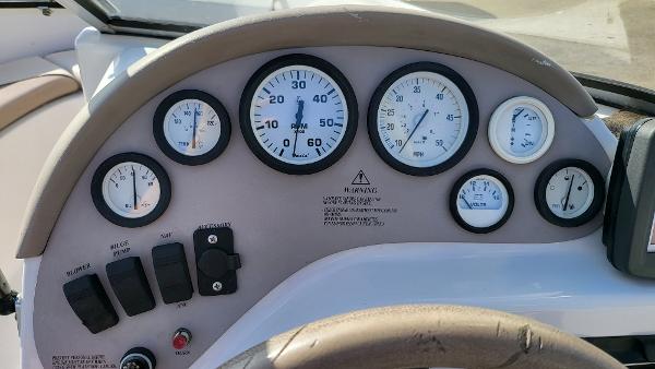 Slide: The Image of 1996 Four Winns 190 Horizon Bowrider dashboard with gauges and controls. - 15