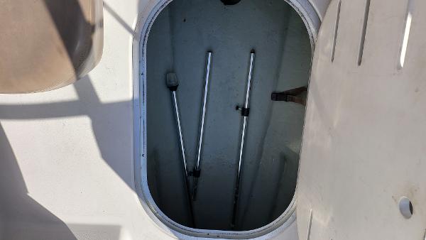 Slide: The Image of Storage compartment of a 1996 Four Winns 190 Horizon Bowrider boat. - 16