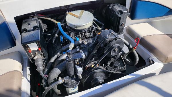 Slide: The Image of 1996 Four Winns 190 Horizon Bowrider engine compartment with visible components. - 17