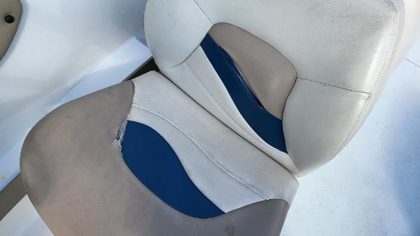 Slide: The Image of Worn seat upholstery of a 1996 Four Winns 190 Horizon Bowrider boat. - 24