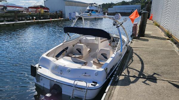 Slide: The Image of 1996 Four Winns 190 Horizon Bowrider docked at a marina on a sunny day. - 3