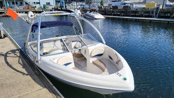 Slide: The Image of 1996 Four Winns 190 Horizon Bowrider docked at a marina. - 5