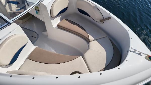 Slide: The Image of 1996 Four Winns 190 Horizon Bowrider boat interior with cushioned seating. - 6