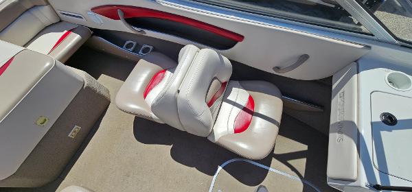 Slide: The Image of Interior of a 1996 Four Winns 190 Horizon DLX boat with beige and red seating. - 10