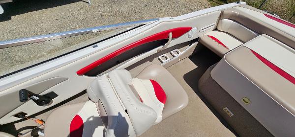 Slide: The Image of 1996 Four Winns 190 Horizon DLX boat interior with red and white seating. - 11
