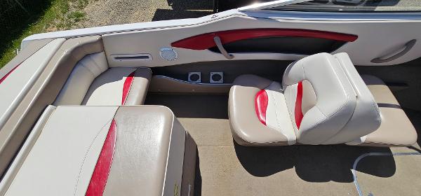 Slide: The Image of 1996 Four Winns 190 Horizon DLX boat interior with red and white seating. - 12