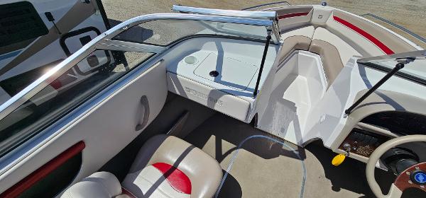 Slide: The Image of 1996 Four Winns 190 Horizon DLX boat interior with seating and dashboard. - 15
