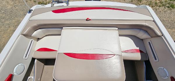 Slide: The Image of 1996 Four Winns 190 Horizon DLX boat interior with beige and red seating. - 16