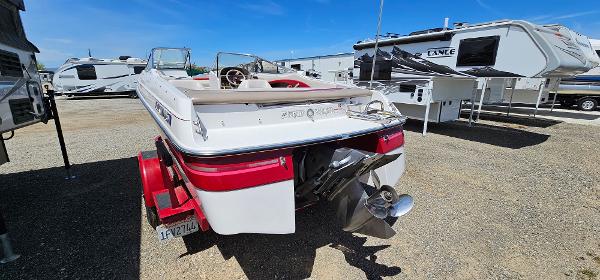 Slide: The Image of 1996 Four Winns 190 Horizon DLX boat on trailer in RV park. - 4