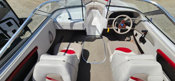 Slide: The Image of 1996 Four Winns 190 Horizon DLX boat interior with white and red seating. - 6