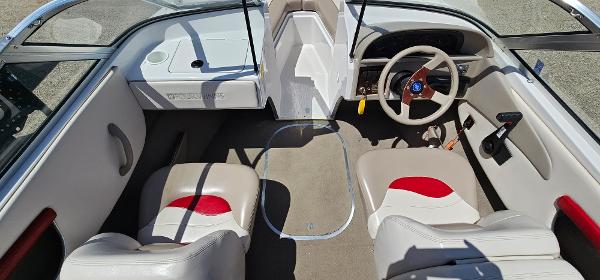 Slide: The Image of 1996 Four Winns 190 Horizon DLX boat interior with beige and red seating. - 8