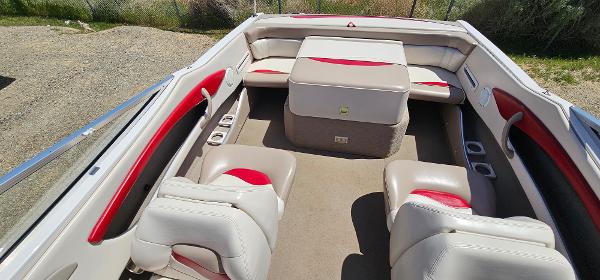 Slide: The Image of 1996 Four Winns 190 Horizon DLX boat interior with white and red seating. - 9