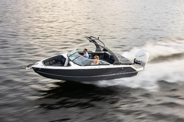 Slide: The Image of 2023 Four Winns H2 OB speedboat cruising on water. - 1
