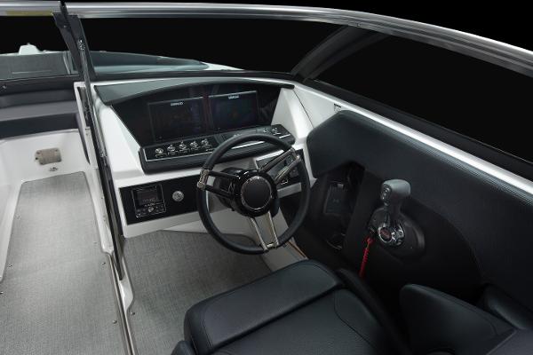 Slide: The Image of 2023 Four Winns H2 OB boat cockpit with steering wheel and control panel. - 12