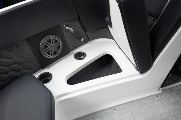 Slide: The Image of 2023 Four Winns H2 OB boat interior with cup holders and speaker. - 14