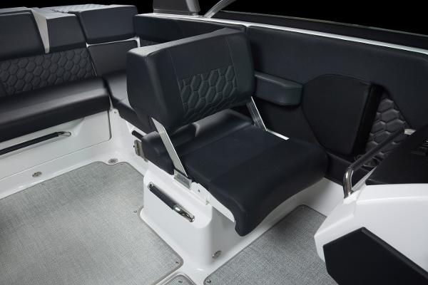 Slide: The Image of 2023 Four Winns H2 OB boat interior with black and gray seating. - 15