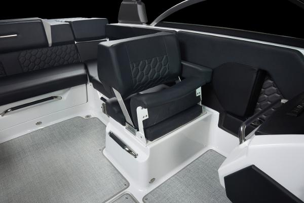 Slide: The Image of 2023 Four Winns H2 OB boat interior with black and gray seating. - 16