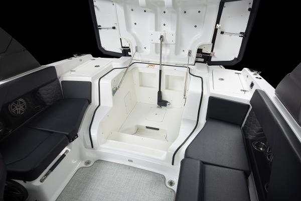 Slide: The Image of 2023 Four Winns H2 OB boat interior with open storage compartment. - 24