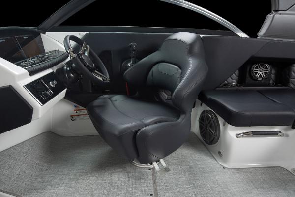 Slide: The Image of 2023 Four Winns H2 OB boat interior with captain's chair and dashboard. - 26