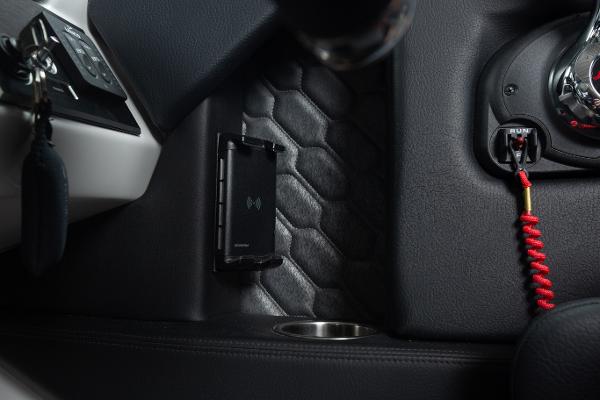 Slide: The Image of 2023 Four Winns H2 OB boat dashboard with wireless charger and ignition key. - 28