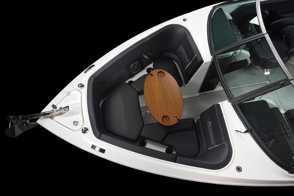 Slide: The Image of 2023 Four Winns H2 OB boat interior with seating and wooden table. - 31