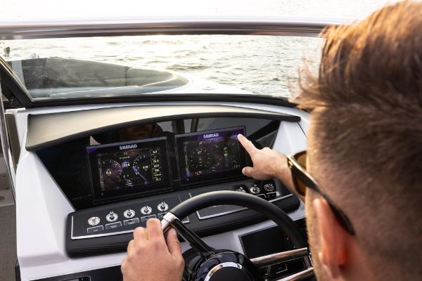 Slide: The Image of 2023 Four Winns H2 OB boat dashboard with touchscreen controls. - 5