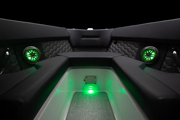 Slide: The Image of 2023 Four Winns H2 OB boat interior with green LED lighting and premium seating. - 6