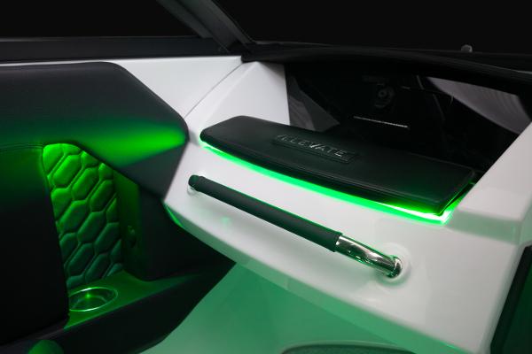 Slide: The Image of 2023 Four Winns H2 OB boat interior with green LED lighting and modern design. - 7