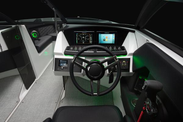 Slide: The Image of 2023 Four Winns H2 OB boat cockpit with modern dashboard and steering wheel. - 9