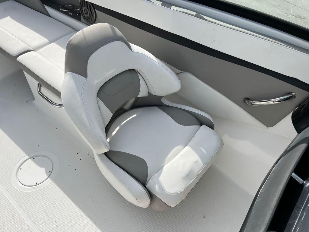 Slide: The Image of 2020 Four Winns HD 200 OB boat interior with white and gray seating. - 12