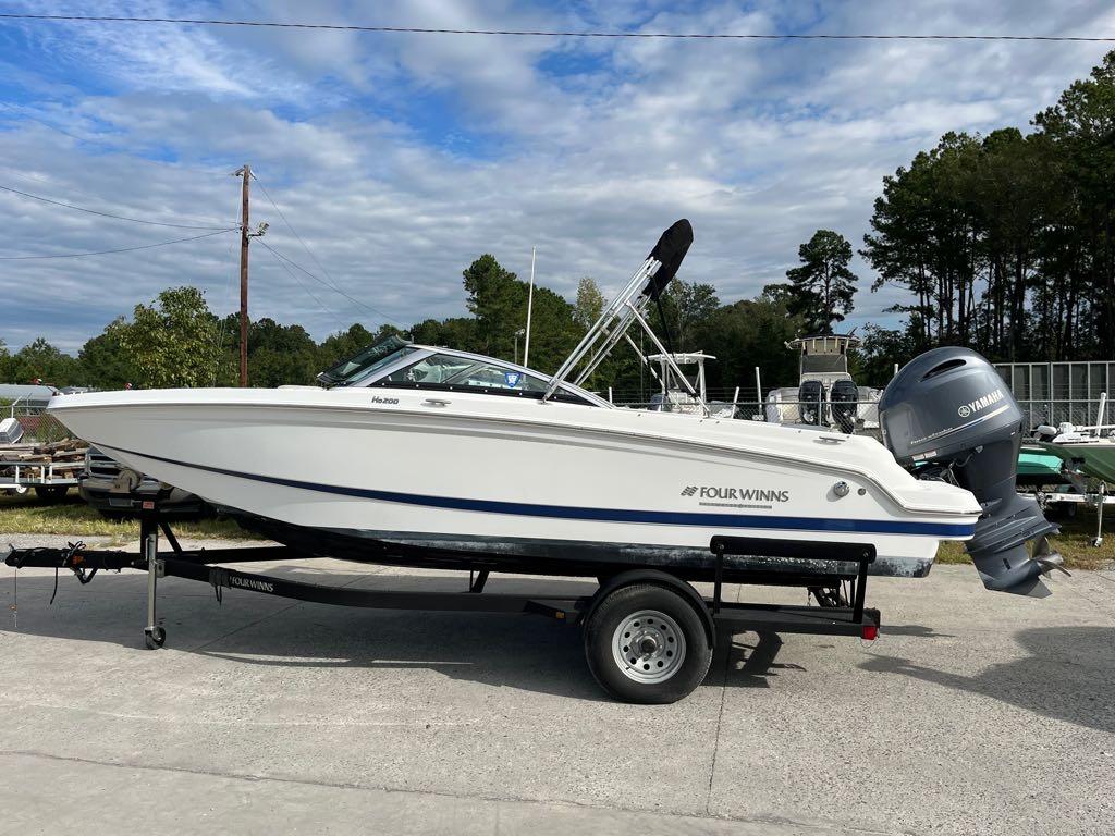 Slide: The Image of 2020 Four Winns HD 200 OB boat on trailer with Yamaha outboard motor. - 13