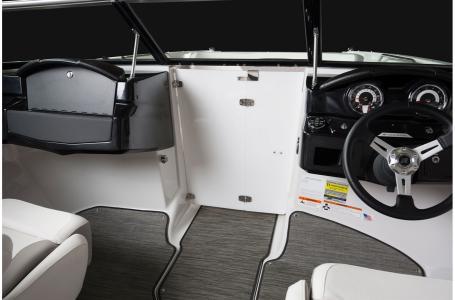 Slide: The Image of 2020 Four Winns HD 200 OB boat interior, steering wheel, and dashboard. - 2