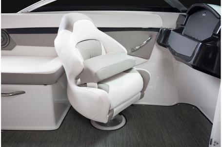 Slide: The Image of 2020 Four Winns HD 200 OB boat interior with captain's chair and dashboard. - 24