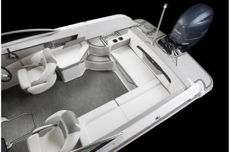 Slide: The Image of 2020 Four Winns HD 200 OB boat interior with seating and outboard motor. - 25