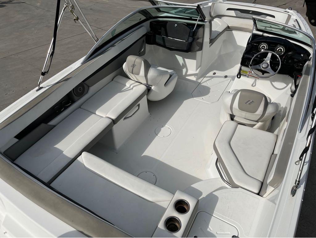 Slide: The Image of 2020 Four Winns HD 200 OB boat interior with white seating and modern dashboard. - 28